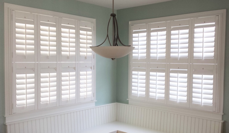 Soft green wall in Southern California kitchen with shutters.